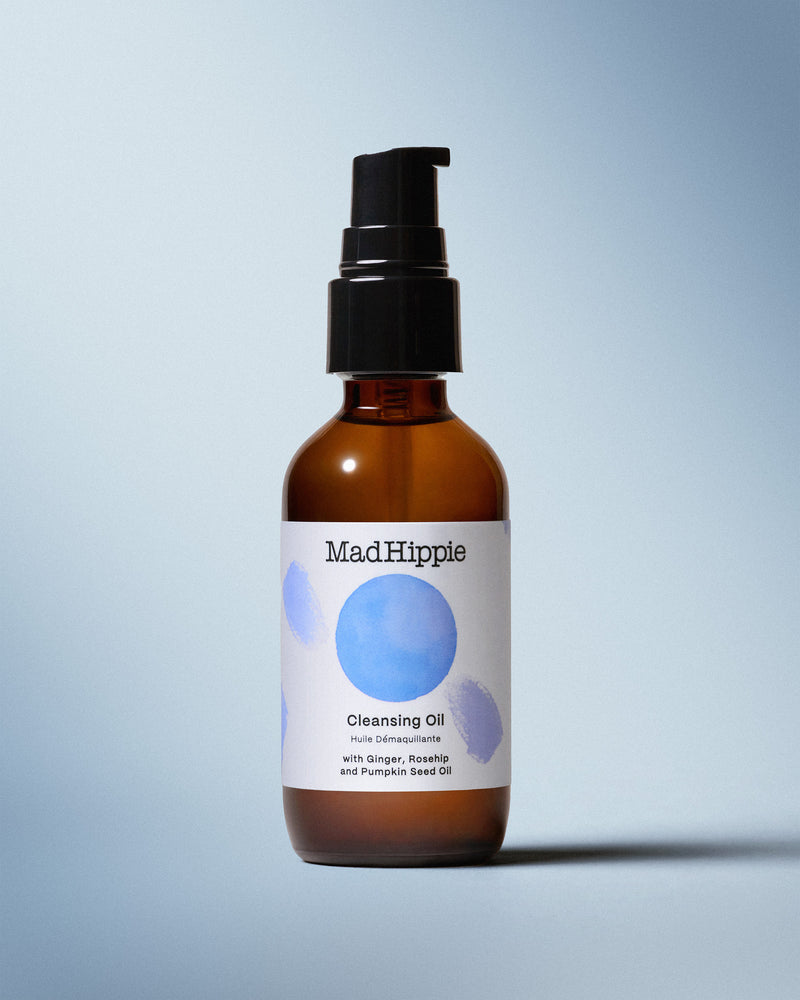 Cleansing Oil Bottle on Blue Background