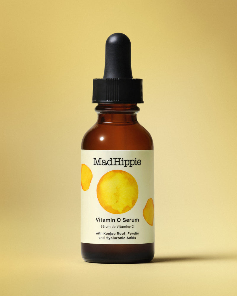 Vitamin C Serum Bottle on Yellow background