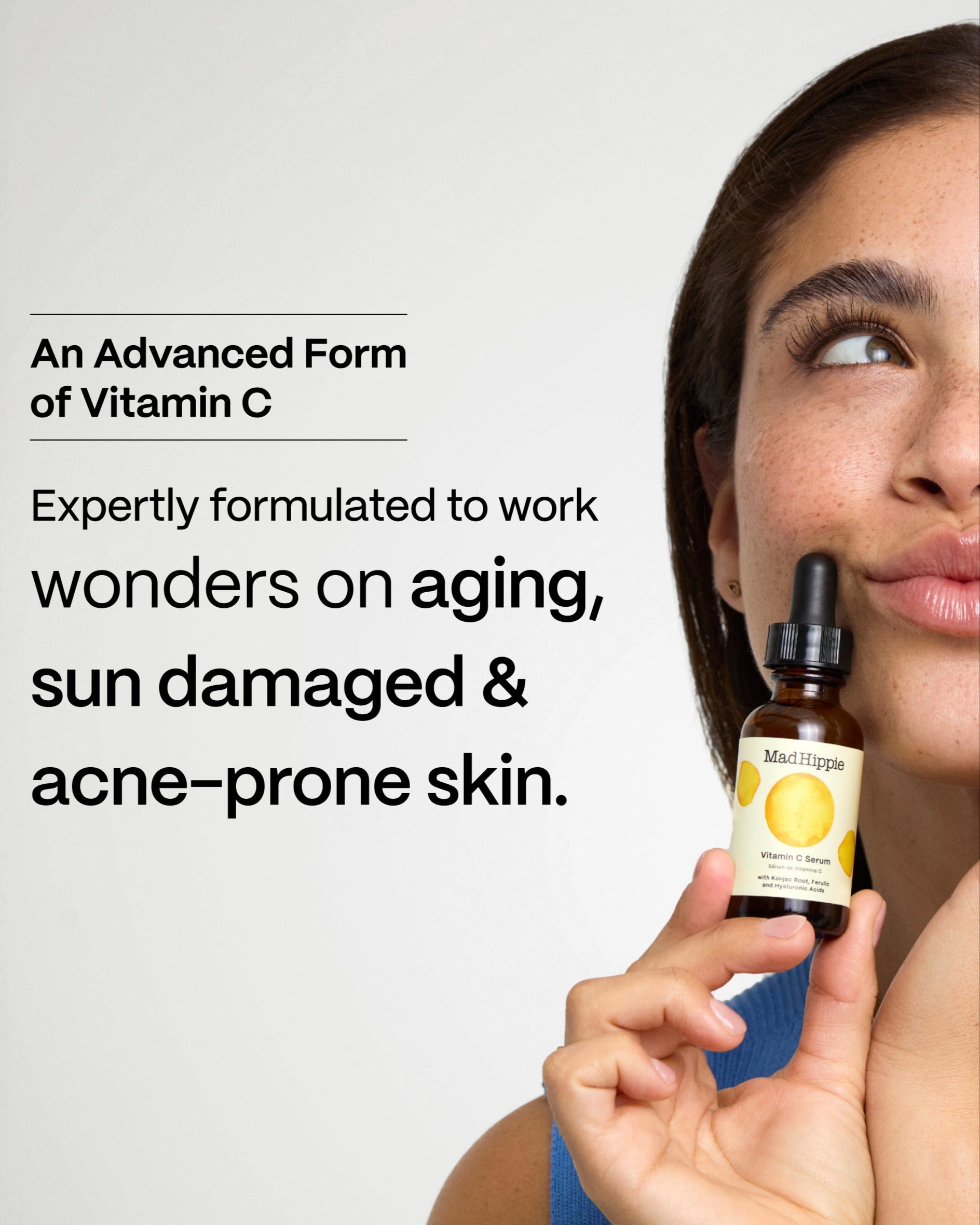 Vitamin C For All Skin Types; model holding Vitamin C Serum bottle against cheek